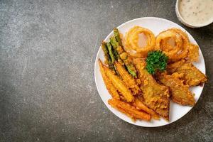 Fried mixed vegetables of onions, carrot, baby corn, pumpkin, or tempura - vegetarian food style photo