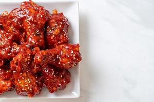 Fried chicken with spicy sauce in Korean style photo