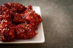 Fried chicken with spicy sauce in Korean style photo
