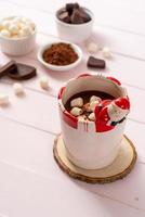 Hot chocolate with marshmallows in cup photo