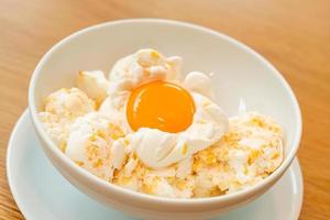 Frozen eggs ice-cream with an egg yolk photo