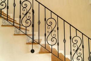 Beautiful stair steps with black handrail photo