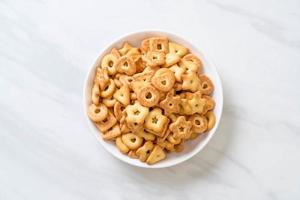 Biscuits cracker with coffee on table photo