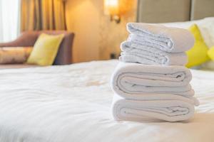 White towel fold on bed in hotel resort photo