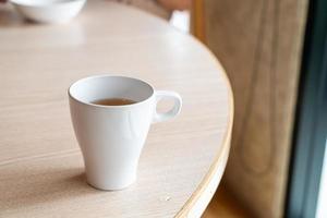 Hot tea cup on table in restaurant photo