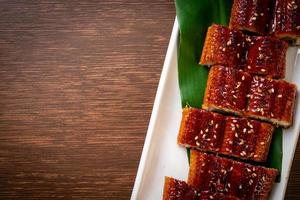 Sliced grilled eel or grilled unagi with sauce - Kabayaki - Japanese food style photo