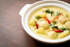 Green curry soup with minced pork and meat ball in bowl - Asian food style photo