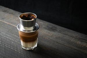 Hot milk coffee dripping in Vietnam style photo