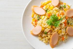 Fried rice with sausage and mixed vegetable photo