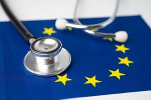 Black stethoscope on EU flag background, Business and finance concept. photo