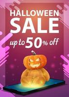 Halloween sale, modern pink vertical banner with the smartphone from which it is projected Teddy bear with Jack pumpkin head vector