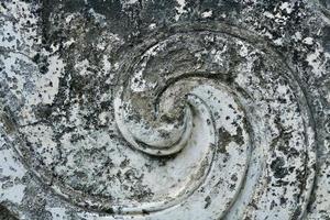 White stucco pattern with peeling in the temple photo