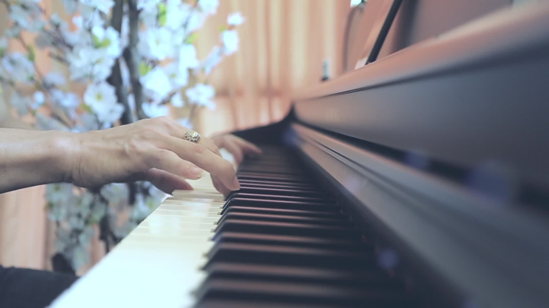 Close up of Hands playing digital piano. Amateur pianist practicing piano