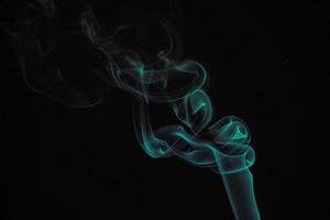 Green smoke on a black background. photo