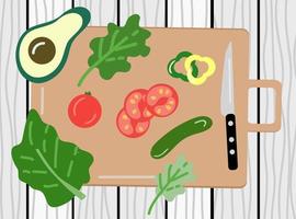 Vegetables and knife on cutting board vector