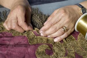 Restoration of tapestries with gold thread, in a workshop in Portugal photo