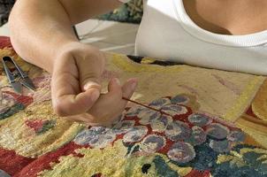 Restoration of tapestries with gold thread, in a workshop in Portugal photo