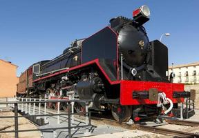 Very old coal locomotive in the town of Arcos de Jalon, Soria province, Castilla y Leon, Spain photo