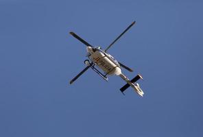 Helicopter of the national police guarding from the air, in the Arganzuela neighborhood in Madrid, Spain photo