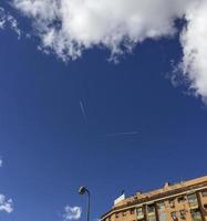 Two planes with perpendicular trajectories, in the sky of Madrid, Spain photo