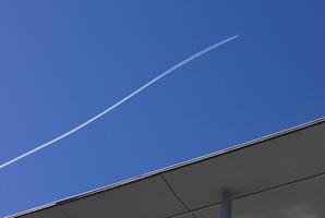 Airplane flying in the blue sky photo