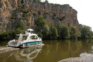 Houseboat cruise on the river Le Lot in France photo