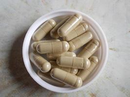 The photo shows medicines, oval capsules