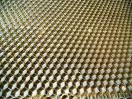 Background hexagon texture, wax honeycomb from a bee hive photo