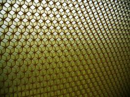 Background hexagon texture, wax honeycomb from a bee hive photo