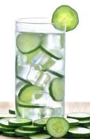 Glass of freshness water with cucumber photo