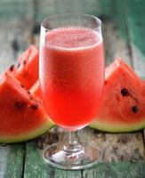 Watermelon drink in glasses with slices of watermelon photo