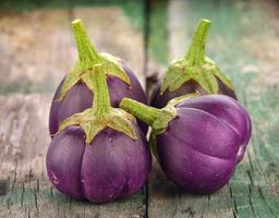 Eggplant on old wooden photo