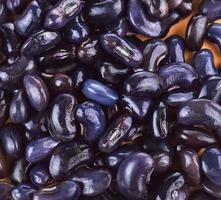 Black beans on wood photo