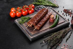 Fresh tasty kebab grilled with spices and herbs photo