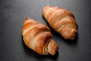 Fresh crisp delicious French croissant with a cup of fragrant coffee photo