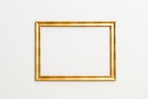 Empty picture frame on white wall background with copy space photo