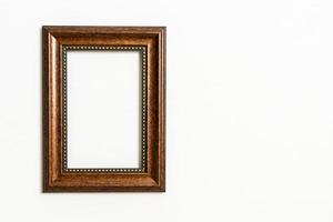 Empty picture frame on white wall background with copy space photo