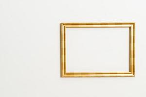 Empty picture frame on white wall background with copy space photo