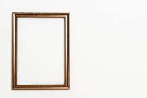 Empty picture frame on white wall background with copy space photo