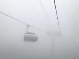 The cable car in fog. Caucasus mountains. Sochi area, Russia photo