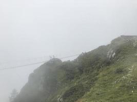 Caucasus mountains wrappednin clouds. Roza Khutor, Russia photo