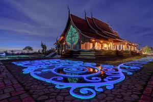 Twilight shot of Sirindhorn Wararam Phu Prao Temple in Ubonrachatani, Thailand photo