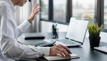 Asian man using computer photo