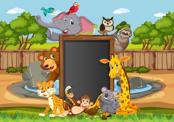 Empty blackboard with various wild animals in the forest