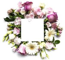 Pink flowers in frame with white square for text photo