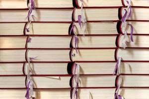 stacked Christian hymn books filling the format as a background photo