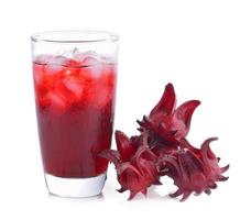 Roselle flower juice in glass with ice isolated on white background photo