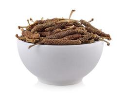 Long pepper in the bowl on white background photo
