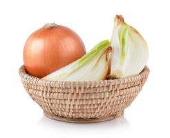 Onion in the basket on white background photo