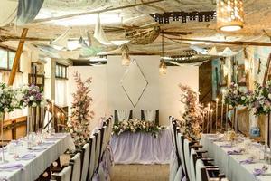 Beautiful floral compositions in the restaurant for the wedding ceremony photo